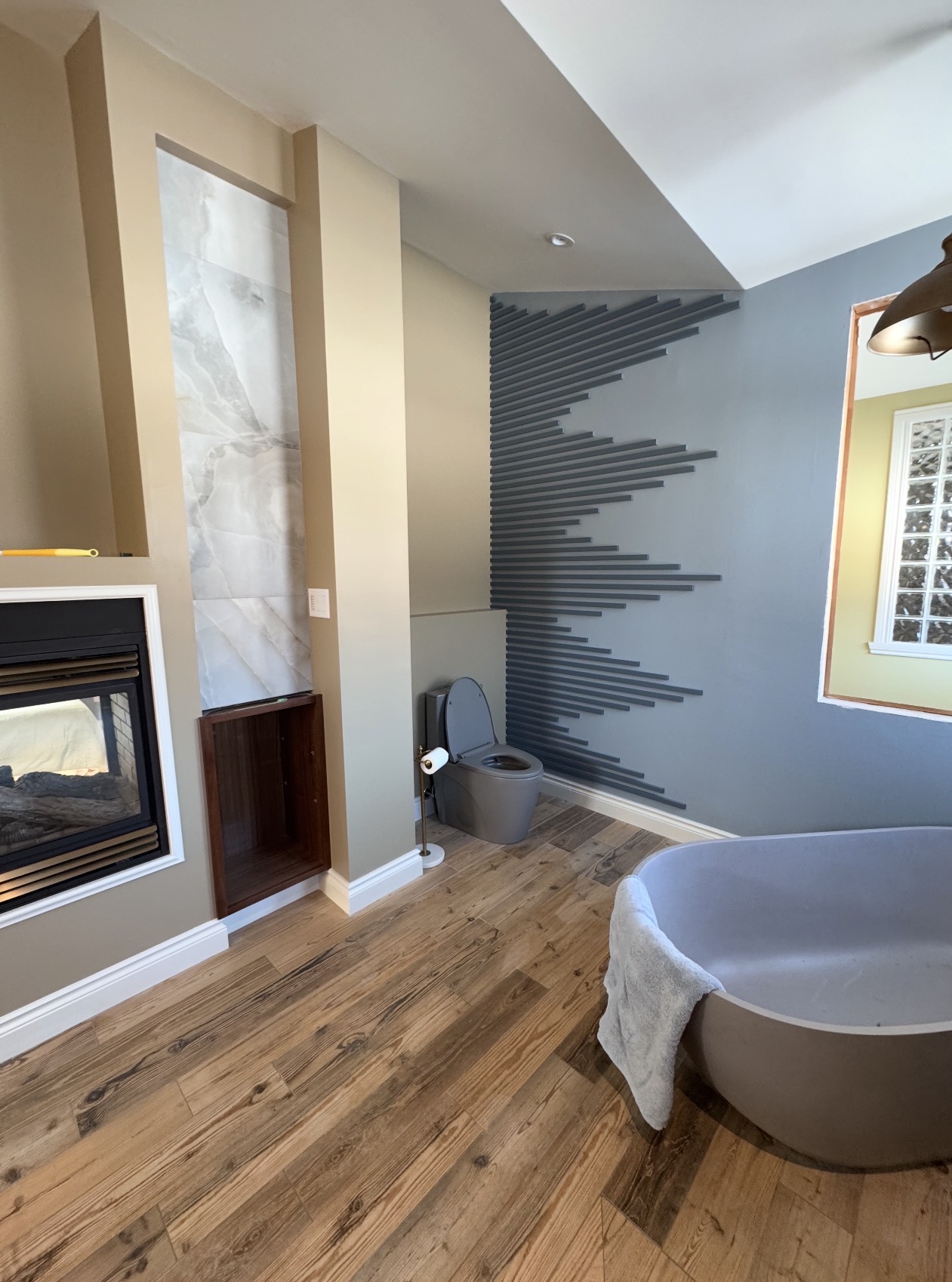 Herringbone tile suite project completed in Orléans by Orleans Flooring Co.